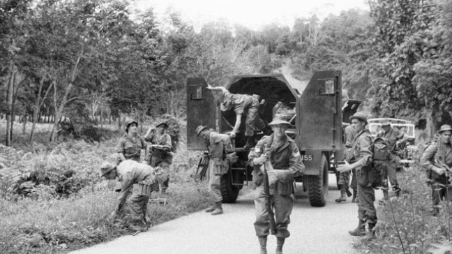 Malayan Emergency - SGT Jock Richardson and platoon exiting truck - AWM HOB/56/0749/MC