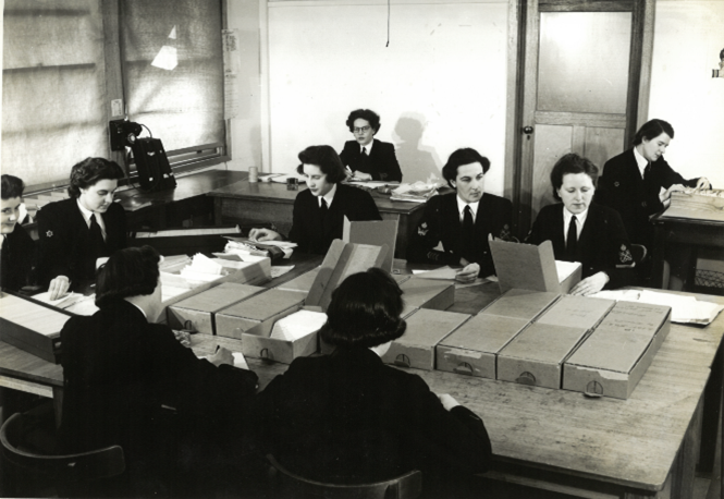 WRANS in the fileroom at FRUMEL. Image from National Archives of Australia (NAA 7648060)